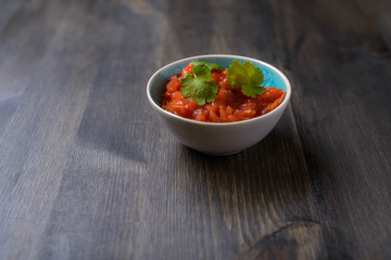Salsa sauce on wood table