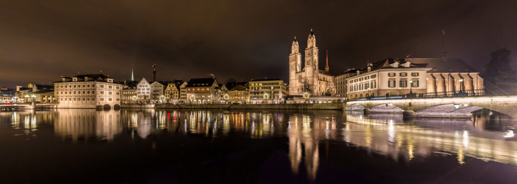 Zurich on banks of Limmat river at winter evening