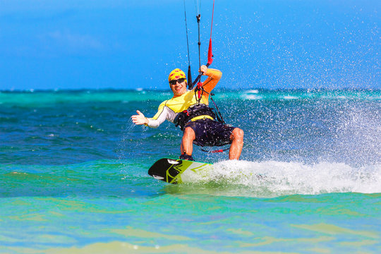 young smiing  kitesurfer on sea background Extreme Sport Kitesur