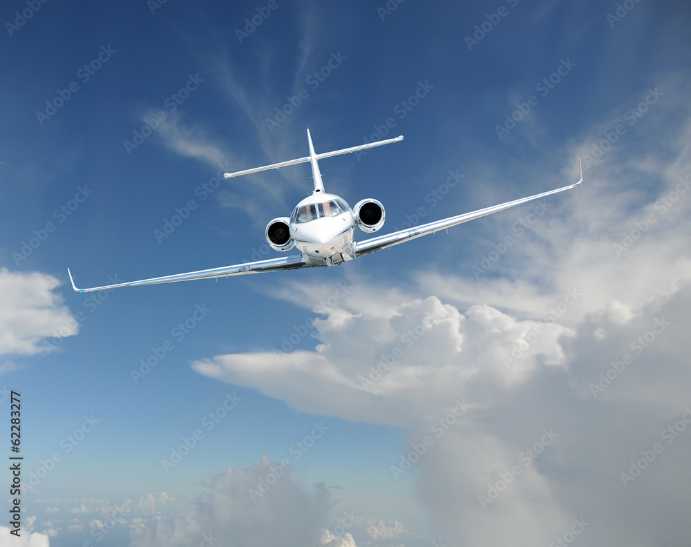 Wall mural Private jet airplane in the sky