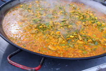 Cooking paella typical from Valencia Spain recipe with rice