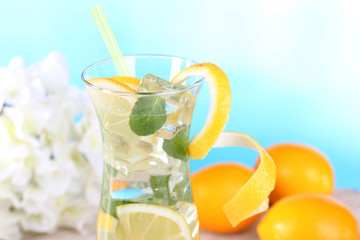 Glass of cocktail with lemon and mint