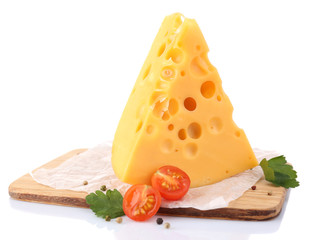 Piece of cheese and tomatoes, on wooden board, isolated on
