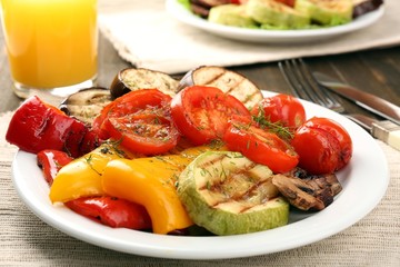 Delicious grilled vegetables on plate on table close-up