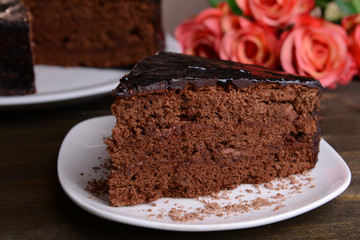 Delicious chocolate cake on table close-up