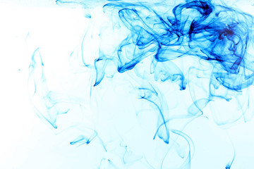 Fototapeta na wymiar Ink in water on blue background