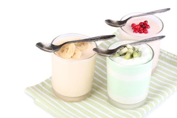 Delicious yogurt with fruits tastes in glasses