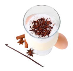 Eggnog with spices isolated on white