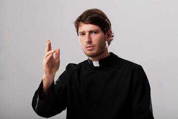 Priest is giving a blessing