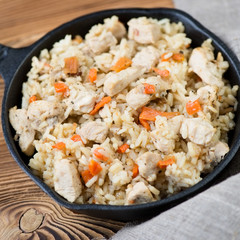 Pilaf with chicken, close-up, studio shot