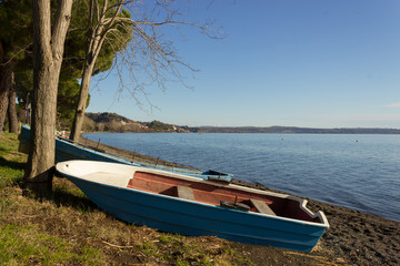 Naklejka na ściany i meble boat on the lake shore