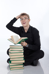 Teen with a pile of books on white background