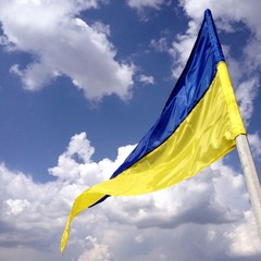 Ukrainian flag on the blue sky