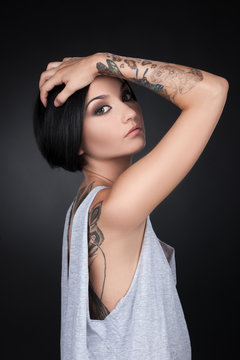 beautiful young girl with tattoo hands.