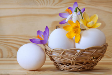 Beautiful flowers and easter eggs basket. 