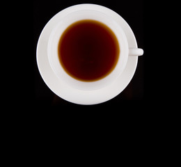 A cup of tea over black background