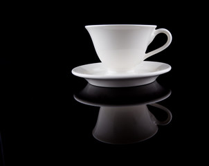 A cup of tea over black background