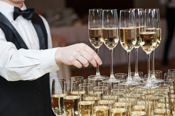 Waiter with glass of champagne