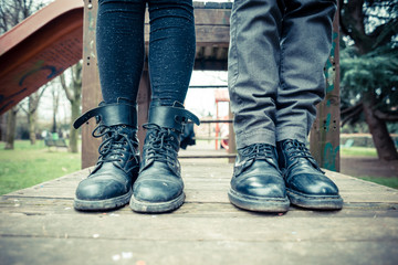 close up legs of young modern stylish couple