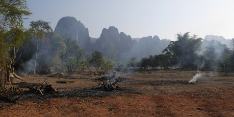 Smoke, red sand, mountains, Vang Vieng, Laos