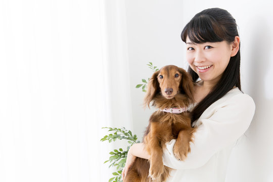young asian woman and dog lifestyle image