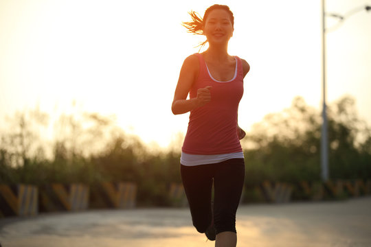 Fitness Woman Runner Running On Mountain Road