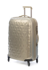 Beige plastic suitcase on wheels for travel.