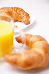 Croissants and a cup of orange juice