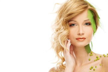 Fototapeta premium Woman in conceptual spring costume touching her face