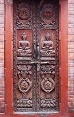 Buddha carved at the entrance door in Kathmandu city, Nepal