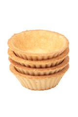 Stack of empty tartlets on white