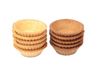 Stack of empty light and dark tartlets
