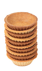 Stack of empty tartlets on white