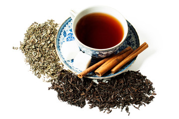 blue and white cup and saucer, cinnamon tea and placer