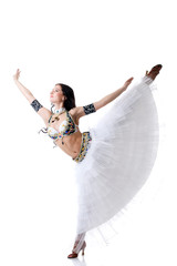 Naklejka premium Smiling belly dancer gracefully posing in studio