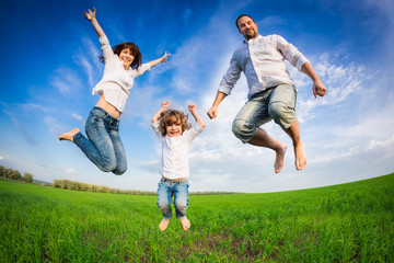 Fototapeta na wymiar Happy family jumping