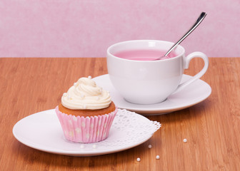 Cupcake And Fruit Tea Cup On Wooden Background