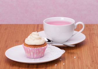 Cupcake And Fruit Tea Cup On Wooden Background