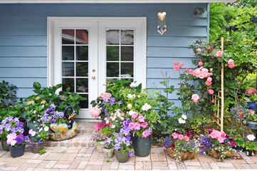 Exterior wall with french door decorated with flowers