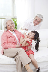 Obraz premium .Senior couple with granddaughter.