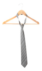 Elegant grey  tie on wooden hanger isolated on white