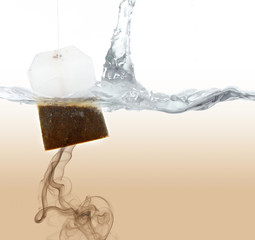 Obraz na płótnie Canvas Tea bag dipped in hot water