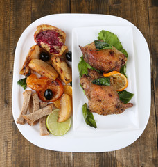 Homemade fried chicken drumsticks with vegetables