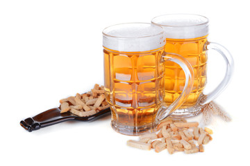 Glasses of beer with snack isolated on white