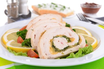 Delicious chicken roll on plate on table close-up