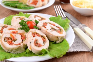 Fototapeta na wymiar Delicious chicken roll on plate on table close-up