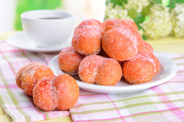 Delicious cookies peaches on table on light background