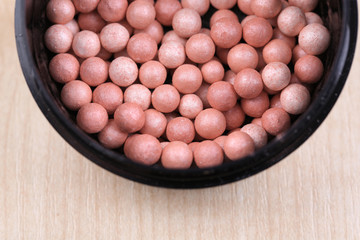 Powder balls on wooden background