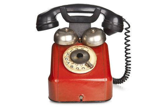 Vintage red telephone isolated over white background