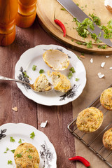 Baked eggs, stuffed with ham and parsley